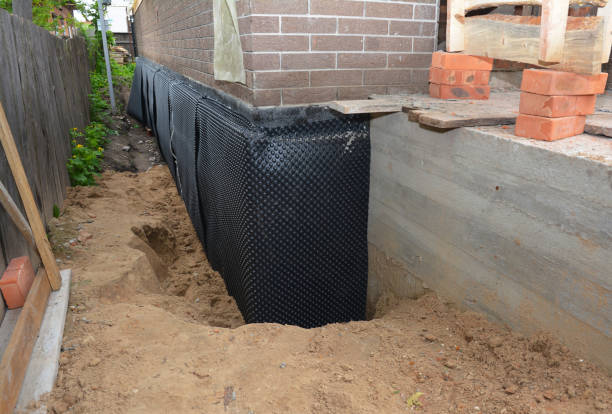 Happy homeowners after waterproofing job in Sanborn